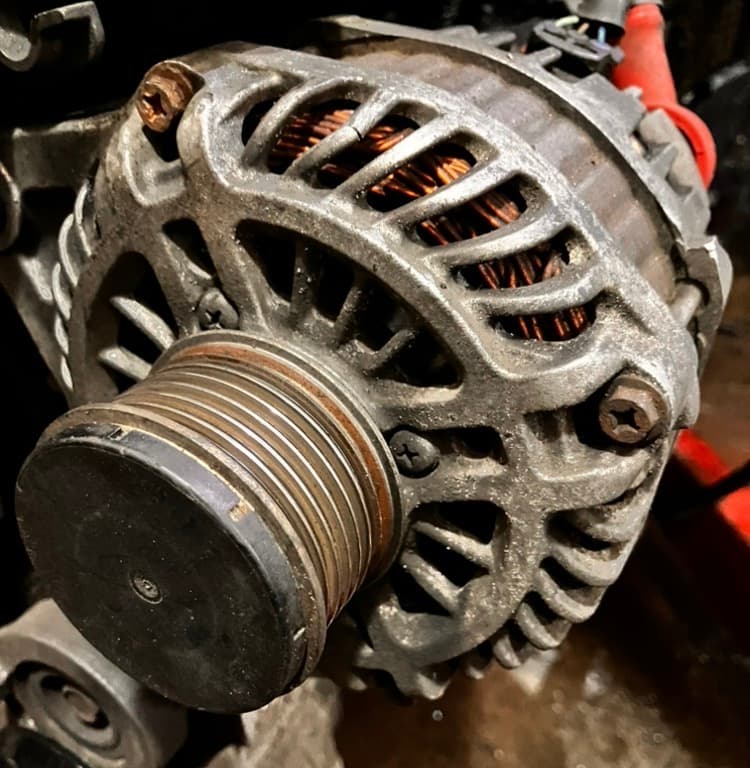 man fixing car engine